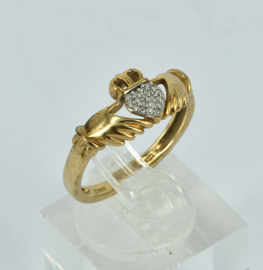 A 10CT GOLD AND DIAMOND CLADDAGH RING
