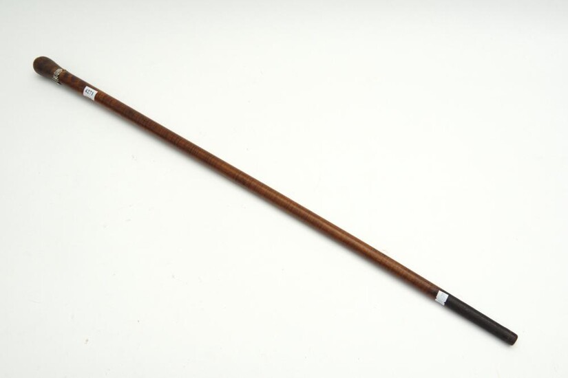 A 19TH CENTURY AUSTRALIAN FIDDLEBACK BLACKWOOD WALKING STICK WITH FLORAL SILVER BAND