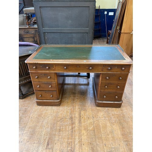 A 19th century mahogany pedestal desk, having nine drawers, ...