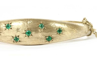 A 9ct gold emerald hinged bangle, by Smith & Pepper