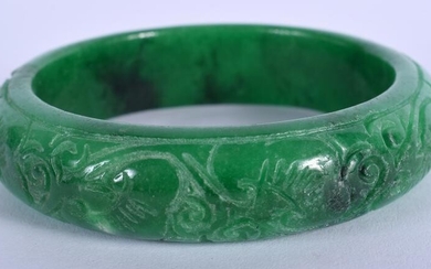A CHINESE APPLE JADE BANGLE. 7.25 cm wide.