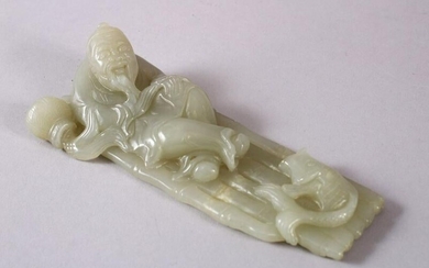 A CHINESE CARVED CELADON JADE FIGURE OF A RECLINED