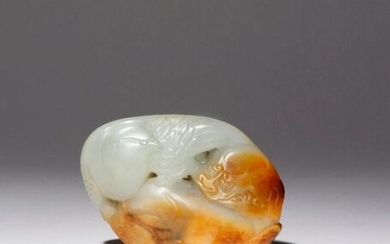 A CHINESE CELADON AND RUSSET JADE 'YINGXIONG' GROUP 18TH CENTURY...
