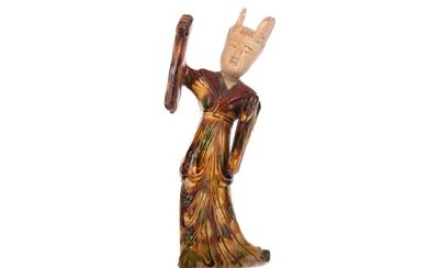 A CHINESE EARTHENWARE FIGURE