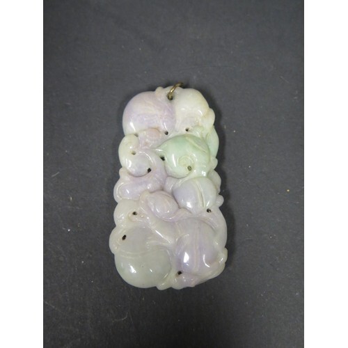 A Chinese Carved Lavender Jade Pendant decorated with an ani...