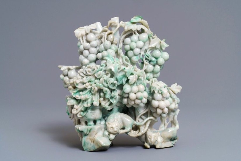 A Chinese jadeite carving of two cats among...