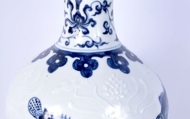 A Chinese porcelain blue and white vase decorated in relief with fish and Algae in relief 27 cm.