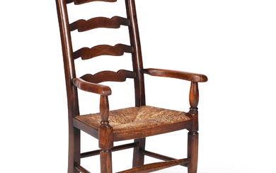 A EARLY 20TH CENTURY OAK RUSH-SEATED CHILD'S CHAIR