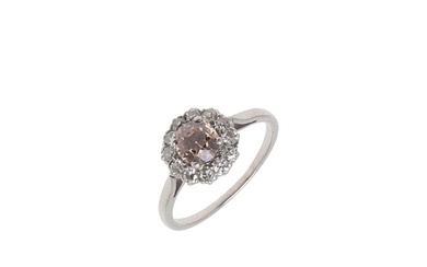 A FANCY COLOURED DIAMOND CLUSTER RING. the round brilliant-c...
