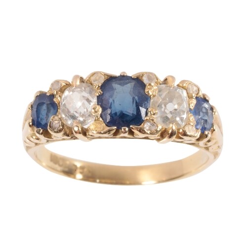 A FIVE STONE SAPPHIRE AND DIAMOND RING three graduated oval-...