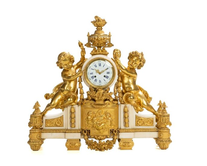 A French gilt-bronze and marble mantel clock retailed