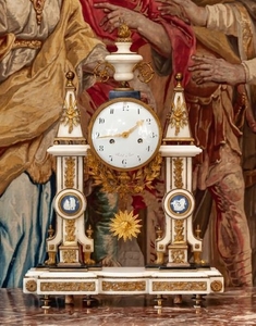 A French ormolu and marble mantel clock decorated …