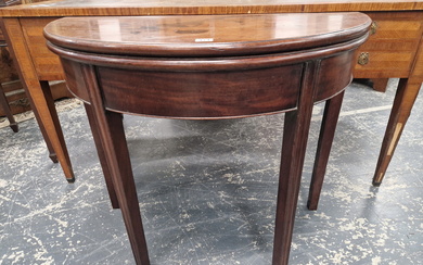 A GEORGE III MAHOGANY DEMILUNE TEA TABLE OPENING ON A SINGLE GATE, THE SQUARE SECTIONED LEGS