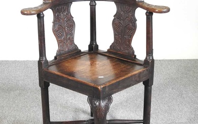 A George III and later carved oak corner chairCondition Report...