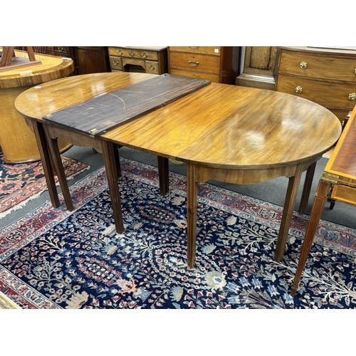 A George III mahogany D end extending dining table, 264cm ex...