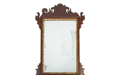 A George III mahogany fretwork wall mirror. The rectangular ...
