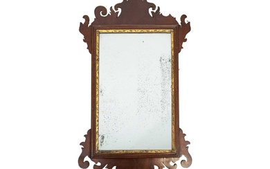 A George III mahogany fretwork wall mirror.