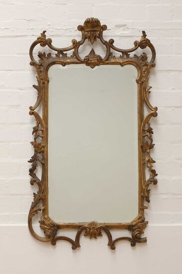 A George III-style carved giltwood wall mirror
