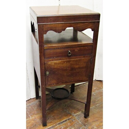 A Georgian mahogany ladies dewing table with rising lid reve...