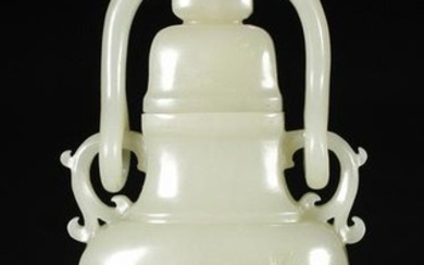 A HETIAN JADE VASE WITH HANDLE CARVED PLUM BLOSSOM