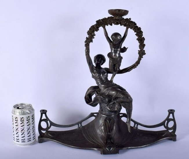 A LARGE ART NOUVEAU PEWTER FIGURAL LAMP modelled upon a