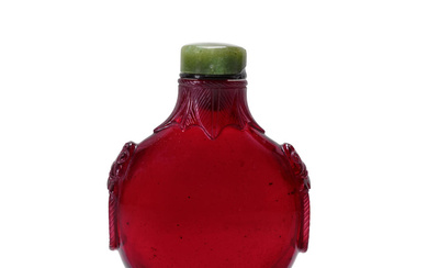 A LARGE TRANSPARENT RUBY-RED GLASS BOTTLE WITH ROPE-TWIST FOOT AND...