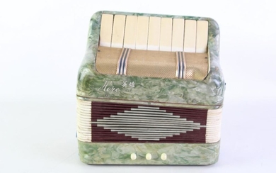 A Miniature Hero Chinese Made Baby Accordian