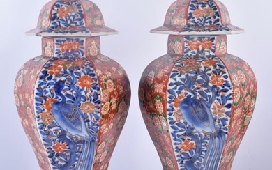 A PAIR OF 19TH CENTURY JAPANESE MEIJI PERIOD IMARI VASES AND COVERS painted with flowers, birds and
