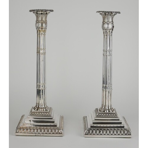 A PAIR OF GEORGIAN SILVER CANDLESTICKS Classical form with b...