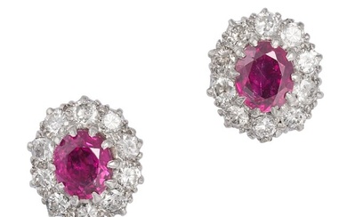 A PAIR OF RUBY AND DIAMOND CLUSTER EARRINGS in yellow gold, each set with an oval cut ruby in a