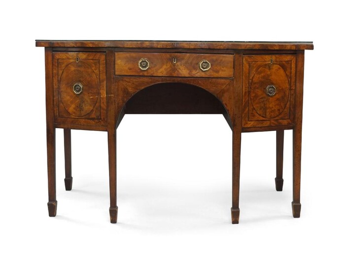 A Regency mahogany bow front sideboard, with three ebony strung drawers, raised on square tapered legs and spade feet, 90cm high, 138cm wide, 68cm deep