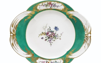A SEVRES PORCELAIN GREEN-GROUND STAND (PLATEAU 'A QUATRE PANS RONDS'), CIRCA 1758, BLUE INTERLACED L'S ENCLOSING DATE LETTER E, UNIDENTIFIED PAINTER'S MARK, INCISED 7