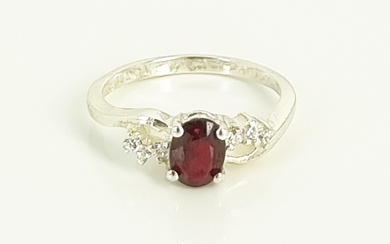 A STERLING SILVER AND RUBY RING