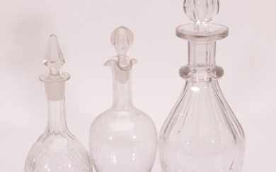 A Set of 3 Glass Decanters in Various Sizes (Chips to base)