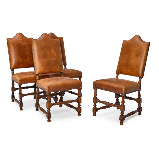 A Set of Four Baroque Style Leather Upholstered Oak Chairs