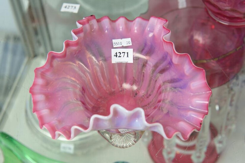 A VICTORIAN RUBY VASELINE GLASS FOOTED FRILLED BOWL
