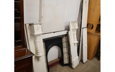 A Victorian slate fire surround with cast iron tiled insert