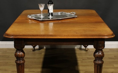 A Victorian walnut and mahogany extending dining table, roun...