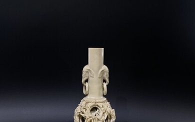 A animal bone carved vase with puzzle balls.