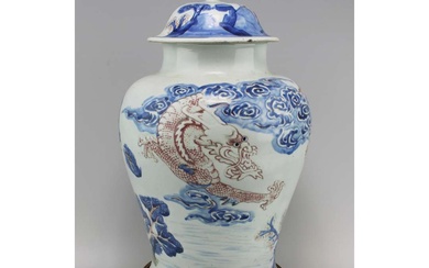 A blue and white dragon & tiger vase with copper red and celadon over relief decoration