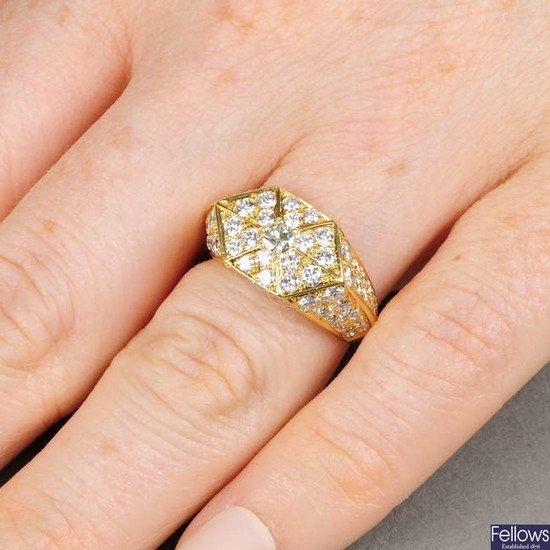 A brilliant-cut diamond geometric ring.