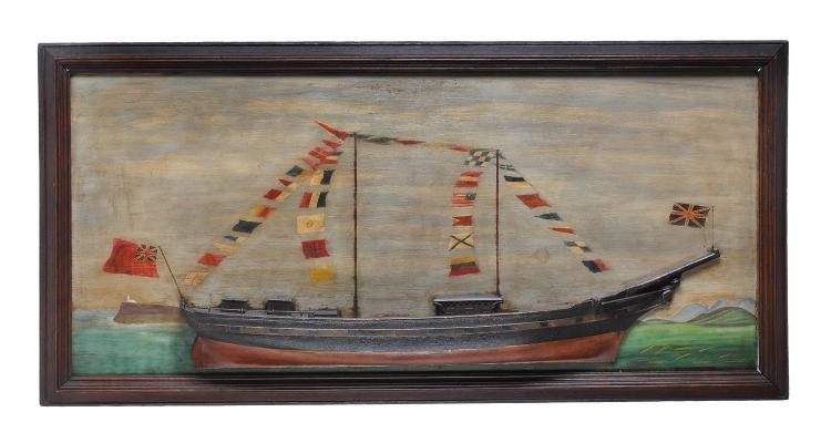 A carved and painted wood half hull picture of a two masted brig