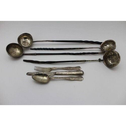 A collection of four 18th century silver toddy ladles, with ...