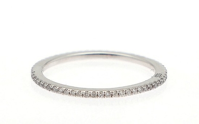 A full diamond eternity ring set with numerous brilliant-cut diamonds, mounted in 14k white gold. W. 1.2 mm. Size 55.5.