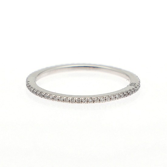 A full diamond eternity ring set with numerous brilliant-cut diamonds, mounted in 14k white gold. W. 1.2 mm. Size 55.5.