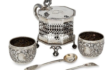 A large Victorian silver mustard, Sheffield, c.1850, maker's mark rubbed, of octagonal form with pierced sides and scroll handle, glass liner deficient, together with a pair of Victorian repousse silver salts, London, c.1893, Wakely & Wheeler, and...