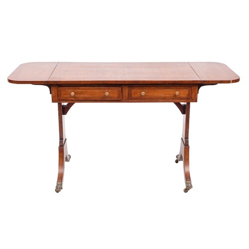 A mahogany and inlaid sofa table in the Regency taste:, bord...