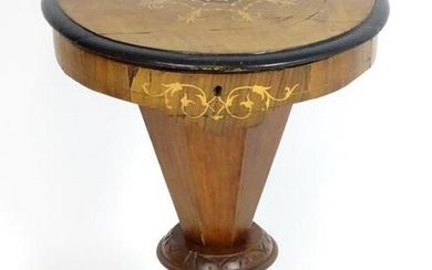 A mid 19thC walnut sewing table with a circular