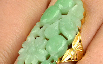 A mid 20th century gold carved and pierced jade dress ring.