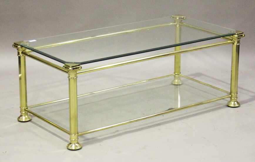 A modern gilt brass and glass rectangular coffee table with Ionic column supports, height 46cm, leng
